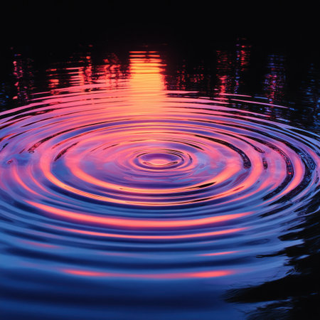 Waves of vibrant colors ripple on calm water as the sun sets, reflecting beauty and peace.の素材