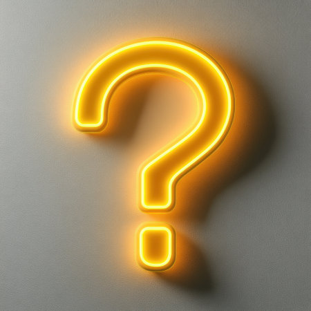 Neon question mark sign illuminates the wall, inviting curiosity and thought at night.の素材