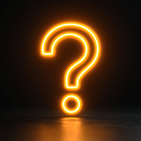 A glowing orange question mark stands out against a black background, sparking curiosity.の素材