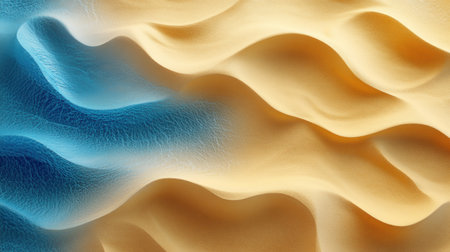 Soft, flowing ridges of blue and gold mimic the movement of waves at the shore.の素材