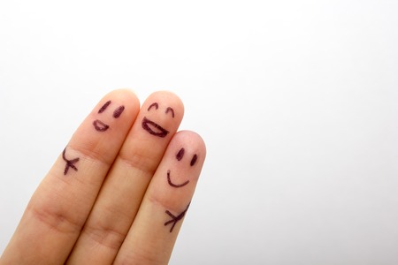 three smiling fingers that are very happy to be friends, family conceptの写真素材