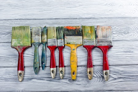 Artistic, artist, art. Used artist paintbrushes mastehin on wood background. Back to school, copy space. Education backgroundの写真素材