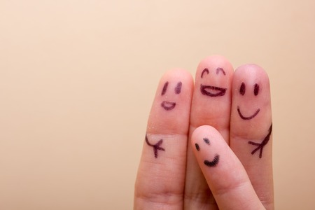 three smiling fingers that are very happy to be friends, family conceptの写真素材