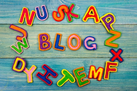 Word BLOG made with plasticine letters on old wooden blue board backgroundの写真素材