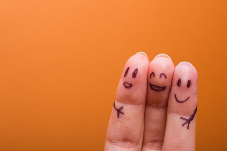 three smiling fingers that are very happy to be friends, family conceptの写真素材