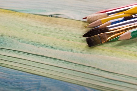 Artistic. Used artist paintbrushes on wood background. Back to school, copy space. Education background.の写真素材