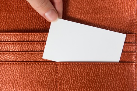 Business card in wallet isolated on white background.