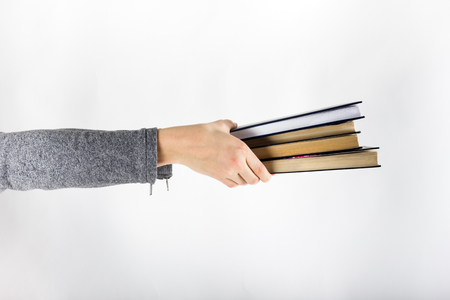Hands holding booksの写真素材