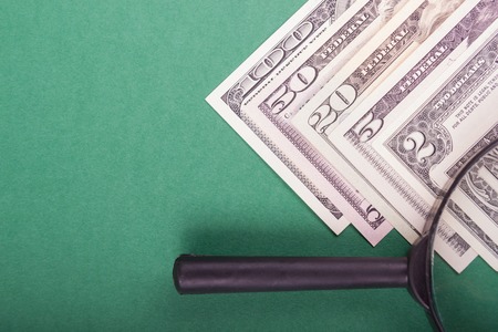 Bribe in businessmen's pocket. One hundred dollars banknoteの写真素材