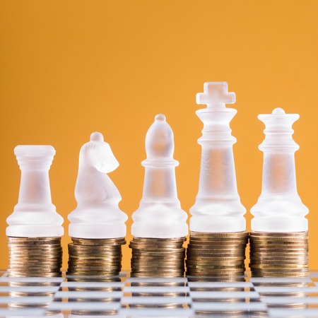 Chess on a golden coins. Investment strategy. Finance concept