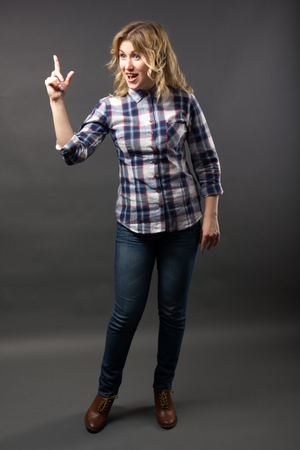 Full length Pretty casual young fashion model in blue jeans posing.の写真素材