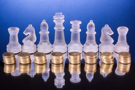 Chess on a golden coins. Investment strategy. Finance concept