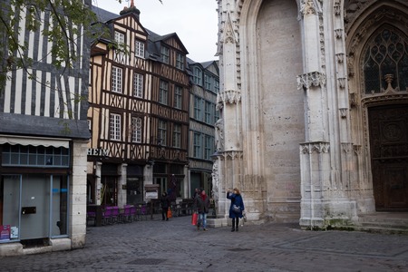 Rouen. Old and tilted houses at Rue Eau de Robec on a rainy day. Rue Eau-de-Robec is one of the main tourist streets of Rouen. Upper Normandy, France.のeditorial素材
