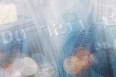 Double exposure of city and graph on rows of coins for finance and banking conceptの写真素材