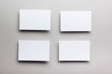 Business card blank on wooden background. Corporate Stationery, Branding Mock-up. Creative designer desk. Flat lay. Copy space for text.の写真素材