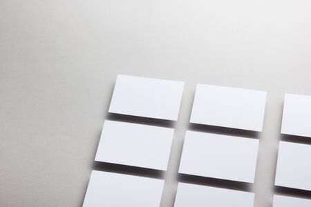 Business card blank on wooden background. Corporate Stationery, Branding Mock-up. Creative designer desk. Flat lay. Copy space for textの写真素材