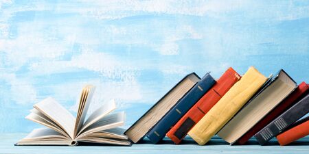 Law concept - Open law book with a wooden judges gavel on table in a courtroom or law enforcement office isolated on white background. Copy space for text.の写真素材