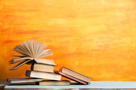Books on wooden desk table and abstract background. Education background. Copy Space. Back to school.の写真素材