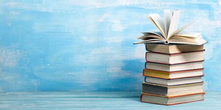 Books on wooden desk tableの写真素材