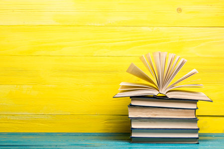 Books on wooden desk table and abstract background. Education background. Copy Space. Back to school.の写真素材