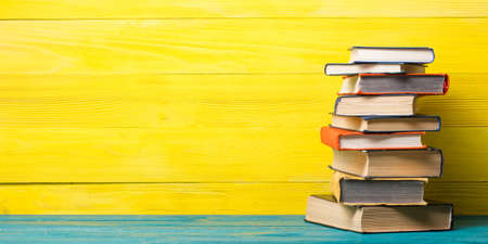 Books on wooden desk table and abstract background. Education background. Copy Space. Back to school.の写真素材