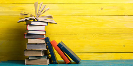 Books on wooden desk table and abstract background. Education background. Copy Space. Back to school.の写真素材