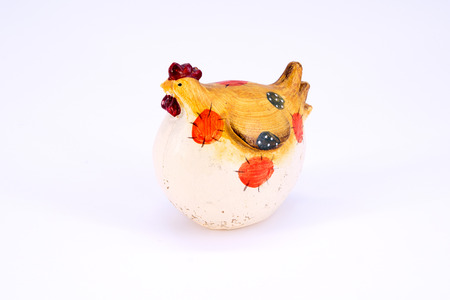 cute toy polyresin chicken isolated on white backgroundの写真素材