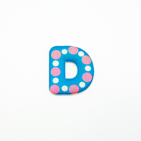 Letter D plastic sticker isolated on white backgroundの写真素材