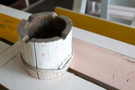 close up old bamboo ashtray on the wooden tableの写真素材