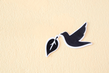 leaf stickers on colorful cement wallの写真素材