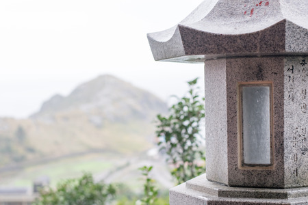 close up old stone lattern with mountain backgroundの写真素材