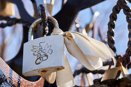 padlock with names newlyweds hung a wedding ceremony. wedding locks of loveの写真素材