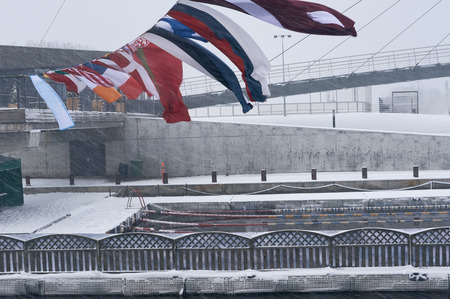 Winter swimming pool snowfall. Swimming pool in winter with snow. Swimming pool for winter sports. Winter sport. winter swimming, outdoor pool which is steaming at a cold winter day.の写真素材