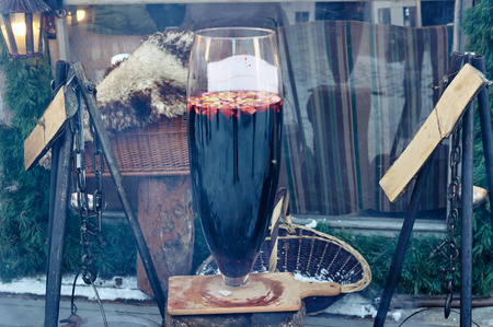 A large of mulled wine glass with pieces of fruit Christmas market.の写真素材