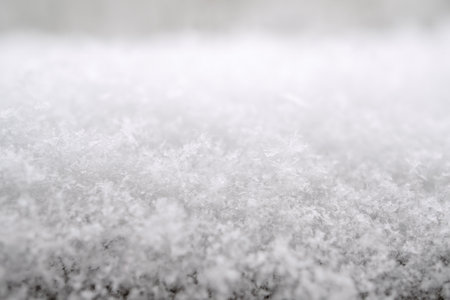close-up photograph of a snow texture, individual flakes are visible, macro photography taken from different angles and differentiated focusの写真素材