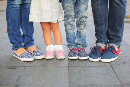Tree pairs of legs of the happy family - father, Mom, Dad, Daughter, Sonの写真素材