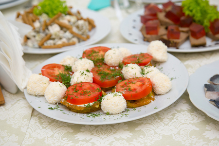 Salad of tomatoes, peppers and cheese. Bufet Tableの写真素材