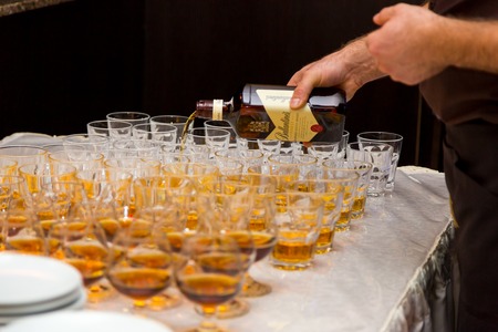 The waiter pours whiskey. Korporate day 12.01.2017 Ukrainain. Lviv.のeditorial素材