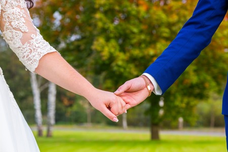 bride and groom holding handsの写真素材