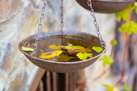 The old iron scales on a stone wallの写真素材