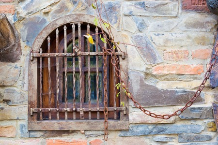 Old window with bars.の写真素材