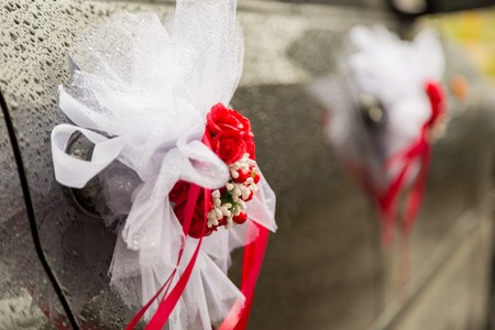 Red wedding decorations for carsの写真素材