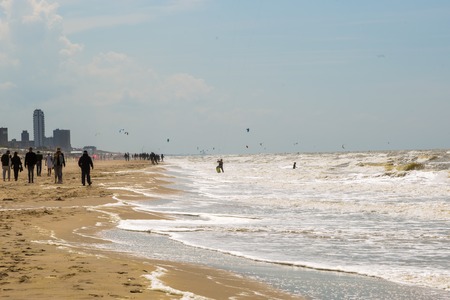 Zandvoort, Netherlands June 10. 2017: Tourists are walking along the sea line. Zandvoort is a main sea resort and touristic center.のeditorial素材