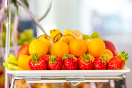 sliced fruit on the buffet table. Healthy food and tasty fruitの写真素材