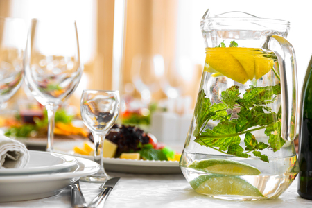 drink with lemon and herbs. A natural drink on a banquet tableの写真素材