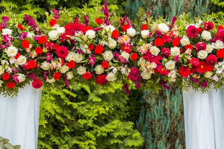 Decorations for the wedding ceremony of red and white roses.の写真素材