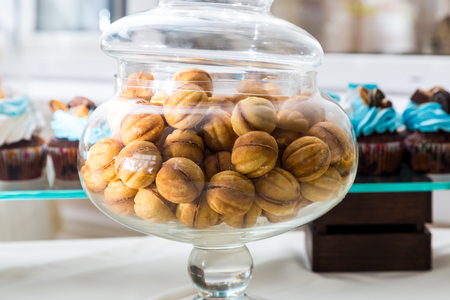 Sweet table Candy Bar. Sweet Nuts in a glass jarの写真素材
