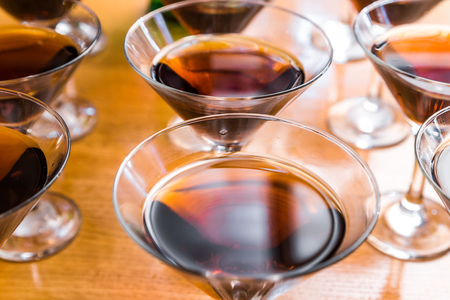 Alcoholic cocktails on a glass surface, banquet table.の写真素材