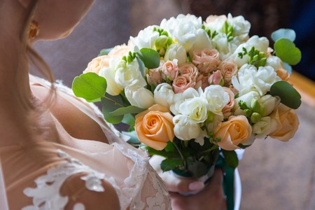wedding bouquet bride behind. Bride holds beautiful.