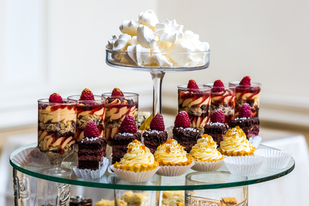 Dessert table for a party. Ombre cake, cupcakes. Weddingの写真素材